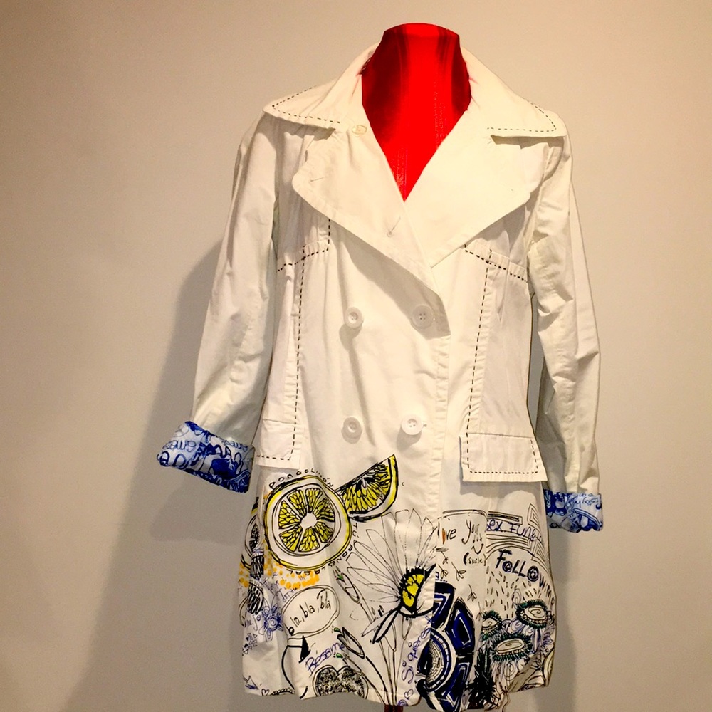 Desigual White Color Trench Coat with Bold Colorful print on bottom of Coat.